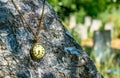 Time to rest Antique decayed pocket watch on black marble tombstone in the cemetery