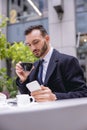 Concentrated brunette male person reading income message Royalty Free Stock Photo