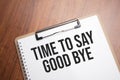 time to say good bye text on white paper on the wood table Royalty Free Stock Photo