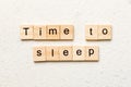 time to sleep word written on wood block. time to sleep text on cement table for your desing, concept