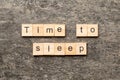 time to sleep word written on wood block. time to sleep text on cement table for your desing, concept