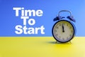 TIME TO START inscription written and Alarm Clock on blue yellow backgroun Royalty Free Stock Photo