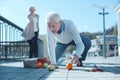 Tired older man falling down with groceries Royalty Free Stock Photo