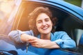 Time to take my new baby for a spin. a happy young woman holding the keys to a new car. Royalty Free Stock Photo