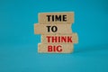 Time to think big symbol. Concept red words Time to think big on brick blocks. Beautiful blue background. Business and time to Royalty Free Stock Photo