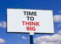 Time to think big symbol. Concept words Time to think big on beautiful big white billboard. Beautiful blue sky cloud background. Royalty Free Stock Photo