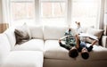 Time to unplug and read a book. two adorable brothers reading books while relaxing together on the sofa at home. Royalty Free Stock Photo