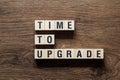 Time to upgrade - word concept on building blocks, text