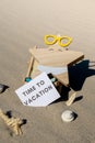 TIME TO VACATION text on paper greeting card on background of beach chair lounge starfish summer vacation decor. Sandy Royalty Free Stock Photo