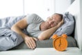 Time to wake up. Tired man in the bed Royalty Free Stock Photo
