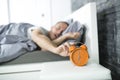 Time to wake up. Tired man in the bed Royalty Free Stock Photo