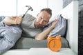 Time to wake up. Tired man in the bed Royalty Free Stock Photo