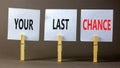 Time to your last chance symbol. Concept words Your last chance on white paper on a beautiful grey table grey background. Business Royalty Free Stock Photo