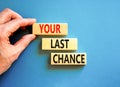 Time to your last chance symbol. Concept words Your last chance on wooden blocks on a beautiful blue table blue background. Royalty Free Stock Photo