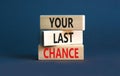 Time to your last chance symbol. Concept words Your last chance on wooden blocks on a beautiful grey table grey background. Royalty Free Stock Photo