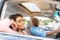 Happy black couple enjoying drive on luxury car Royalty Free Stock Photo