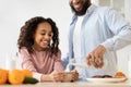 Afro Girl And Her Handsome Dad Pouring Milk In Cereal Royalty Free Stock Photo