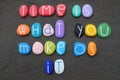 Time is what you make of it, wise words composed with multicolored stone letters over black sand Royalty Free Stock Photo