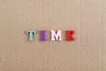 TIME word on paper background composed from colorful abc alphabet block wooden letters, copy space for ad text. Learning english Royalty Free Stock Photo