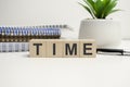 Time word on the wooden cube and pen. Time management concept Royalty Free Stock Photo