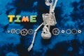 Time wording beside  cogwheels and  artificial skeleton as time concept Royalty Free Stock Photo