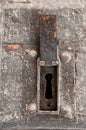 Time-worn door with a big keyhole