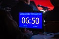 Timekeeper in dark seminar room Royalty Free Stock Photo