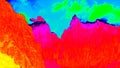 Timelaps of clouds above rocky Alpine peaks. Amazing thermography colors