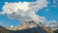 Timelapse of dancing clouds above the mountains. Mountain landscape. Piz d\'Err mountain, Albula Range of the Alps, Savognin,