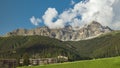 Timelapse of dancing clouds above the mountains. Mountain landscape. Piz Mitgel mountain, Albula Range of the Alps, Savognin,