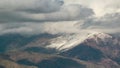 Timelapse of high mountains view with flowing clouds