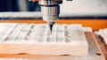 A timelapse image recording of a CNC machine completing a series of s capturing the transformation of the raw material