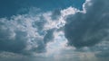 Light High Clouds Slide On Sky. Puffy Fluffy White Clouds Sky. Blue Sky With Clouds Moving In Opposite Direction And Sun Royalty Free Stock Photo