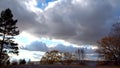 Timelapse - low cumulus and thunderclouds fly over the lake shore. Change of cyclone to anticyclone. Autumn landscape