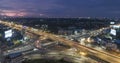 Timelapse of night city traffic on 4-way stop street intersection circle roundabout in bangkok, thailand. 4K UHD horizontal aerial