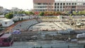 Timelapse pan view construction site doing base work in a sunny afternoon
