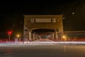 Timelapse shot of car lights on the road near a tunnel at night in Pavia, Italy Royalty Free Stock Photo