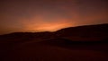 Timelapse of sunrise over sand dunes