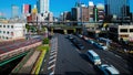 A timelapse of traffic jam at Iidabashi station in Tokyo daytime wide shot panning