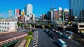 A timelapse of traffic jam at Iidabashi station in Tokyo daytime wide shot zoom