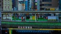 A timelapse of traffic jam at Iidabashi station in Tokyo daytime long shot zoom