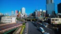 A timelapse of traffic jam at Iidabashi station in Tokyo daytime wide shot tilt