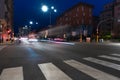 Timelapse view of traffic at an urban night intersection. Urban movement in the Italian city in the evening Royalty Free Stock Photo