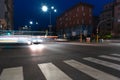 Timelapse view of traffic at an urban night intersection. Urban movement in the Italian city in the evening Royalty Free Stock Photo