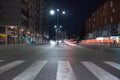 Timelapse view of traffic at an urban night intersection. Urban movement in the Italian city in the evening Royalty Free Stock Photo