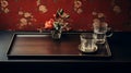 Timeless Nostalgia: A Delicate Tray With Dark Brown And Crimson Vase And Glass Of Water