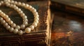 Timeless pearl necklace on an antique book, evoking a sense of history