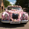 Timeless Romance: Classic Wedding Car with \'Just Married\' Plate and Flower Decorations Royalty Free Stock Photo