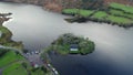 Gougane Barra, County Cork, Ireland, where water flows gracefully around a historic chapel