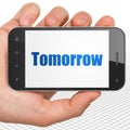 Timeline concept: Hand Holding Smartphone with Tomorrow on display